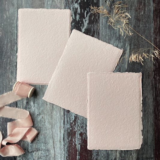 blush pink handmade cotton rag paper with deckled edges.  A5 size pink recycled cotton rag paper