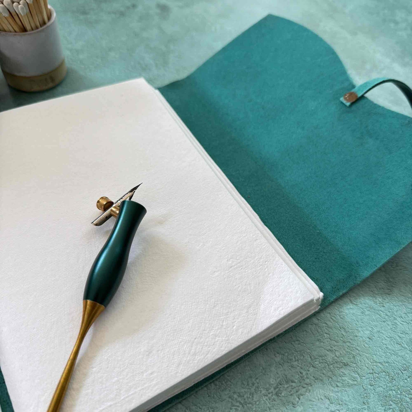 Hand Made Leather notebook in navy and teal with handmade cotton paper pages