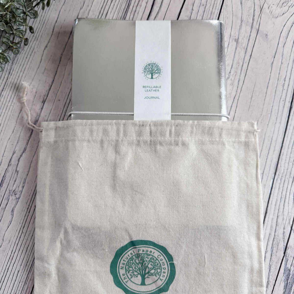 Metallic silver A5 refillable leather journal with Natural Paper Company gift bag