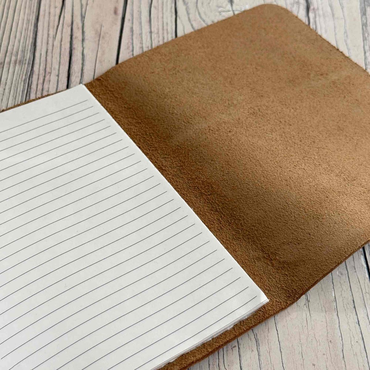 A5 silver leather journal open to lined paper insert for writing and journalling