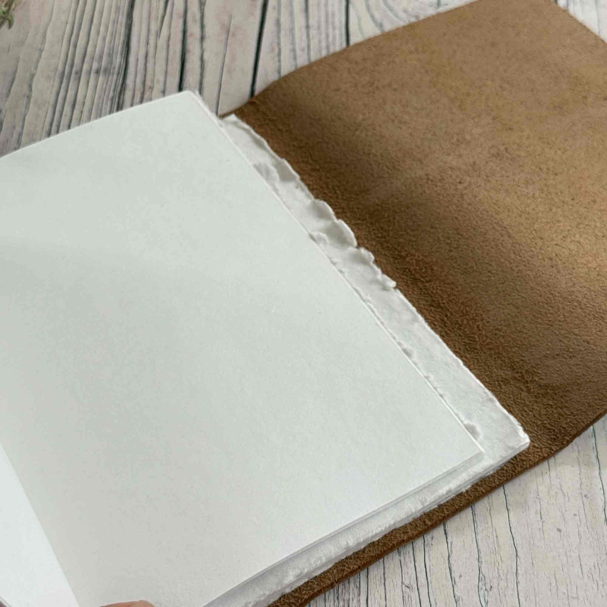 A5 silver leather journal open to blank refill insert for drawing and sketching