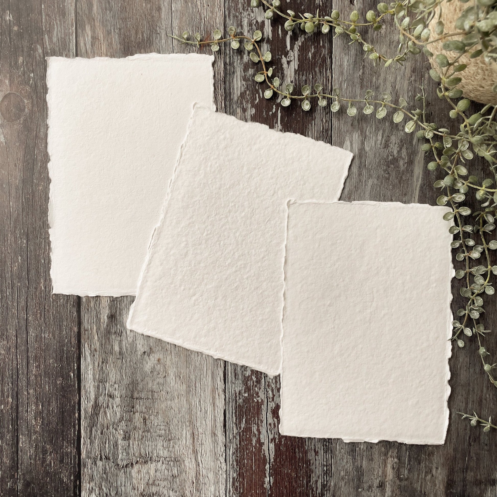 White handmade paper.  Recycled cotton rag paper with deckled edges.  Handmade in the traditional way.  Vegan watercolour paper.  By The Natural paper Company