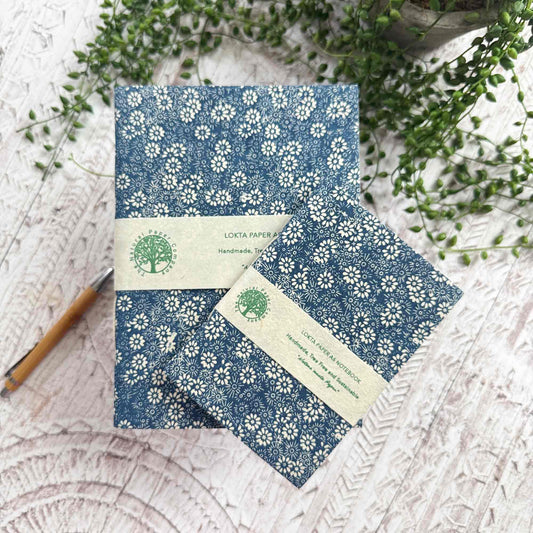 Bellis Blue Lokta paper notebook by The Natural Paper Company. Handmade in Nepal from sustainable Lokta paper, featuring hand-stitched binding and indigo floral print. Available in A5 and A6 sizes