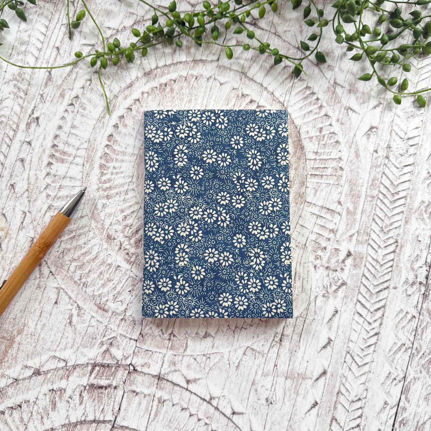 A6 Bellis Blue Lokta paper notebook by The Natural Paper Company. Handcrafted in Nepal from sustainable Lokta paper, with indigo floral print and traditional hand‑stitched binding