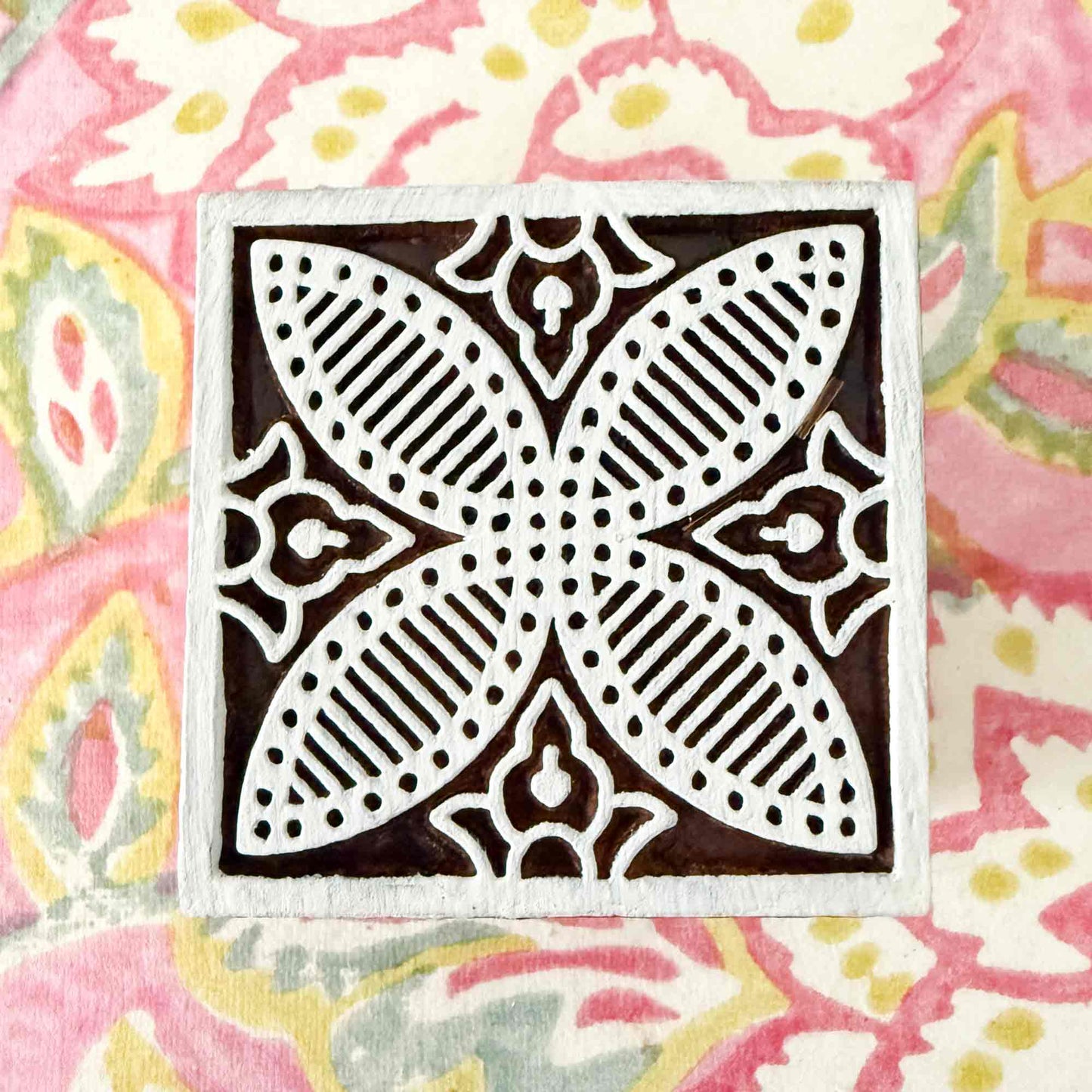 decorative tile stamp made from wood.