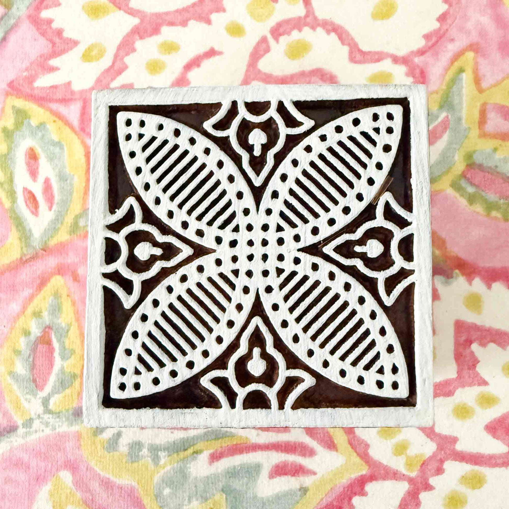 decorative tile stamp made from wood.