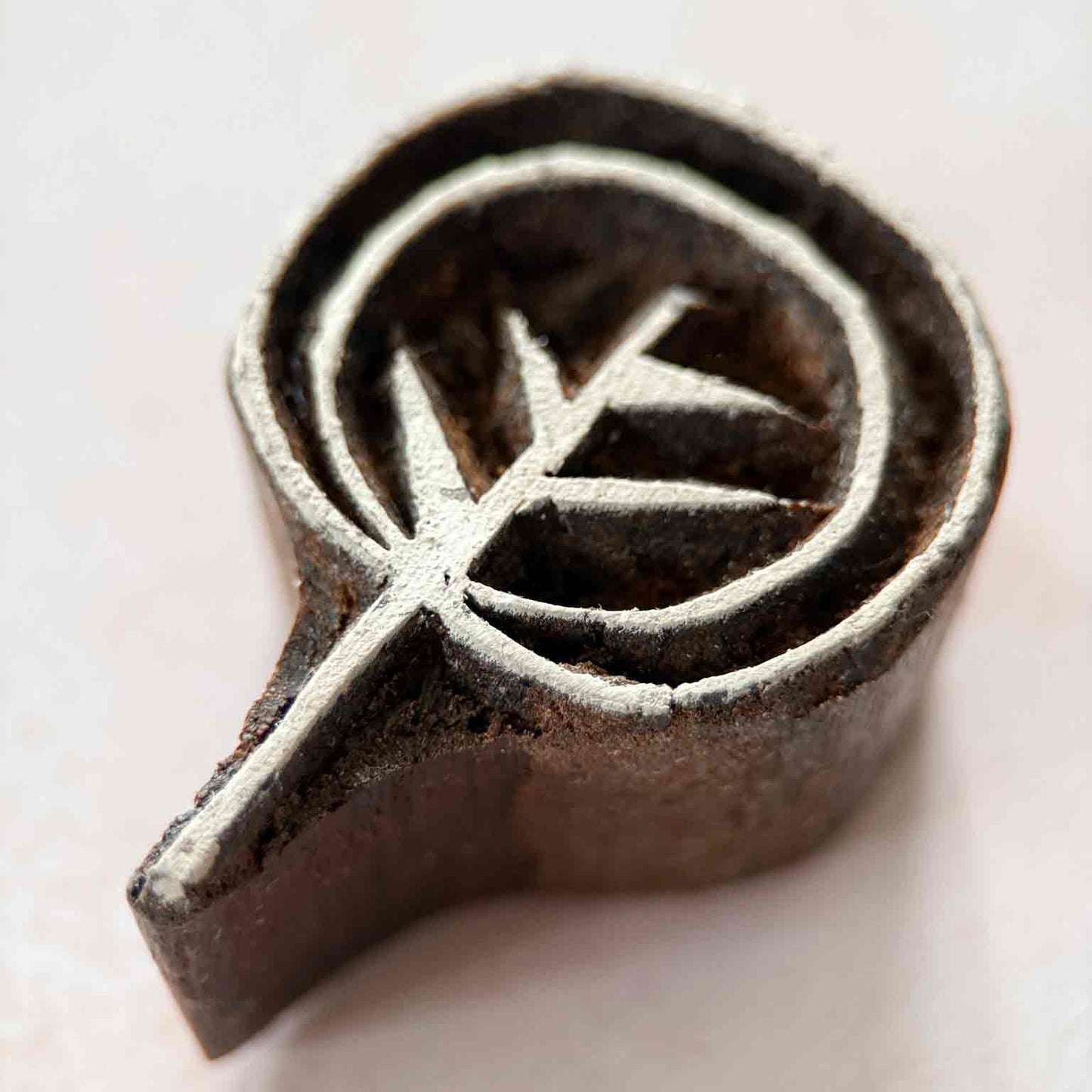 Close-up Ankur Indian Wood Block Stamp showing a simple botanical branch with pointed leaves and circular border.