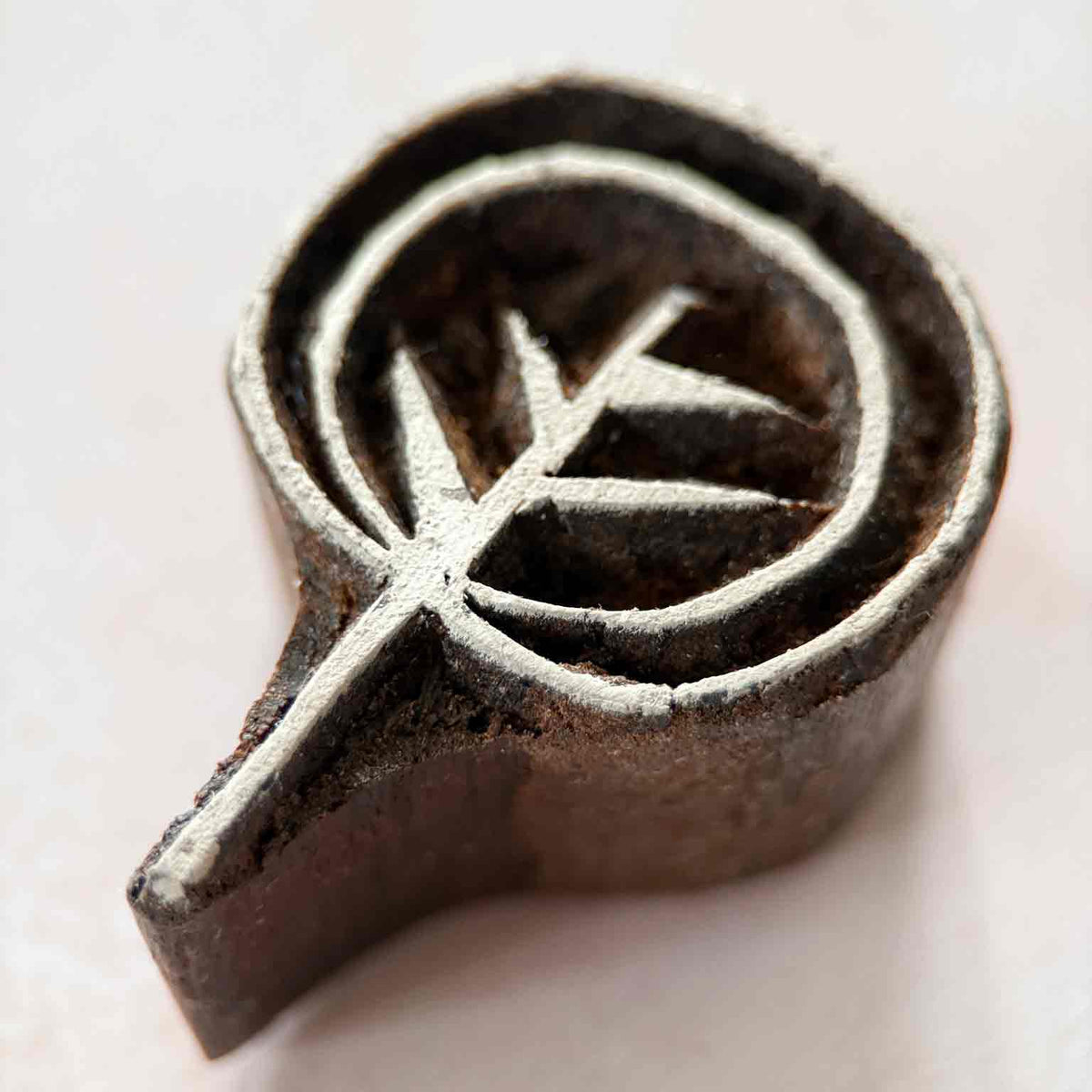 Close-up Ankur Indian Wood Block Stamp showing a simple botanical branch with pointed leaves and circular border.