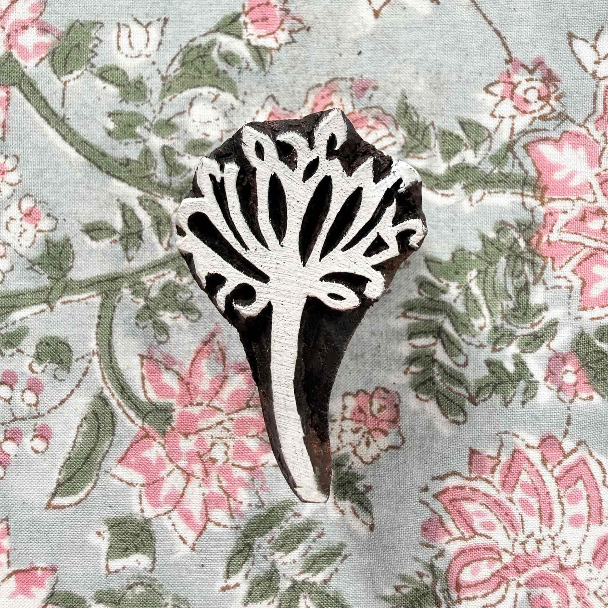 Aranya botanical Indian wood block stamp displayed on block printed fabric