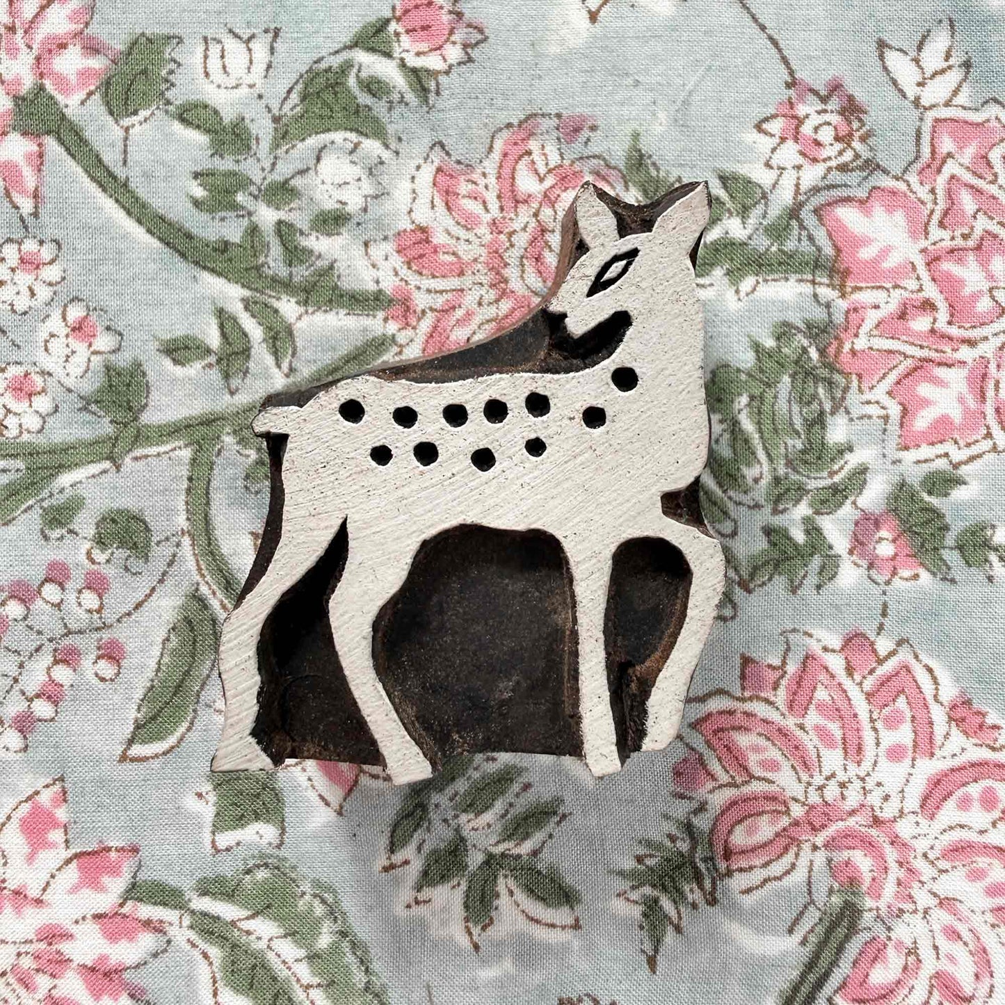 Indian wood block stamp — Bambi spotted deer resting on block printed fabric, sweet fawn design ready for printing, handcrafted wooden stamp, classic traditional printing block woodland motif
