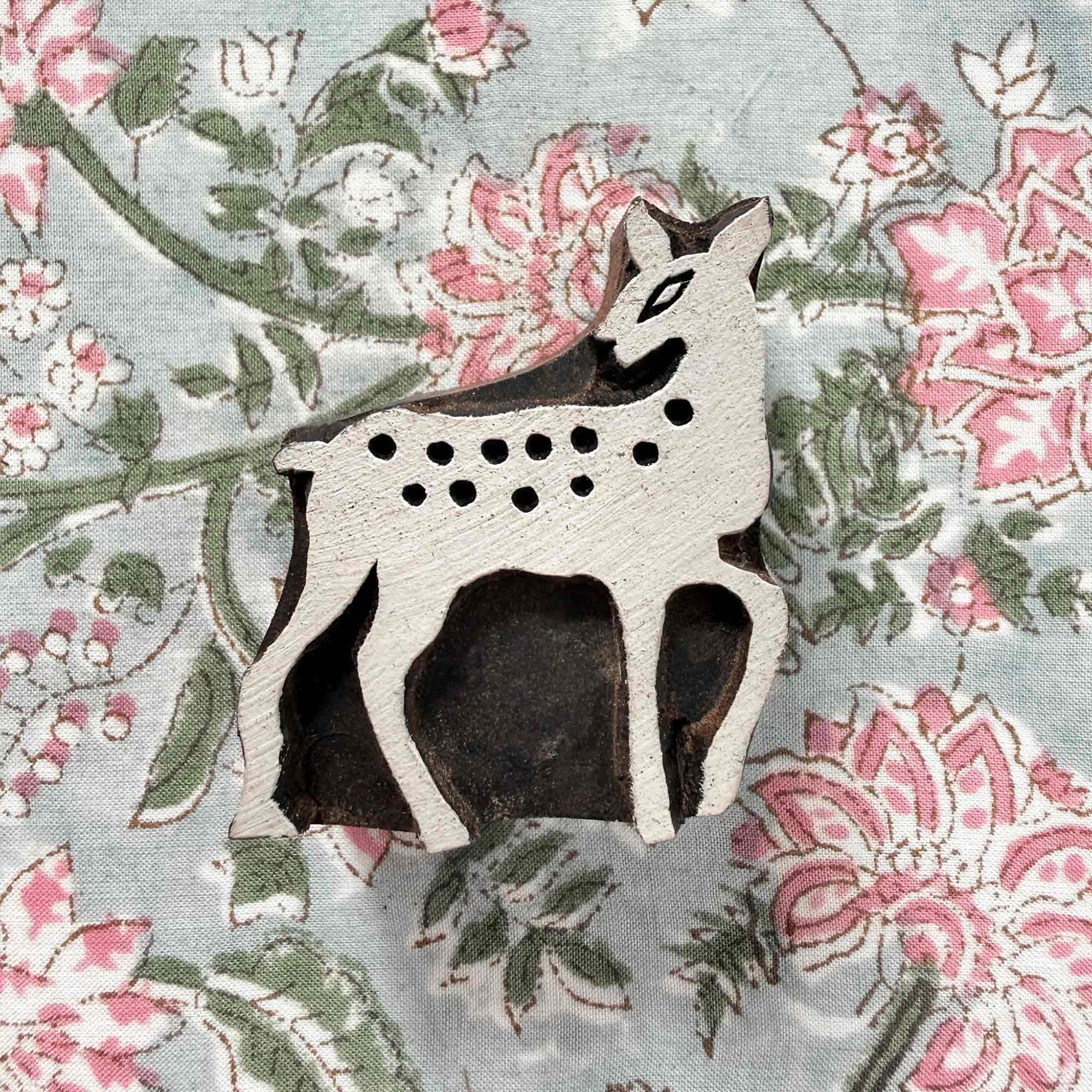 Indian wood block stamp — Bambi spotted deer resting on block printed fabric, sweet fawn design ready for printing, handcrafted wooden stamp, classic traditional printing block woodland motif
