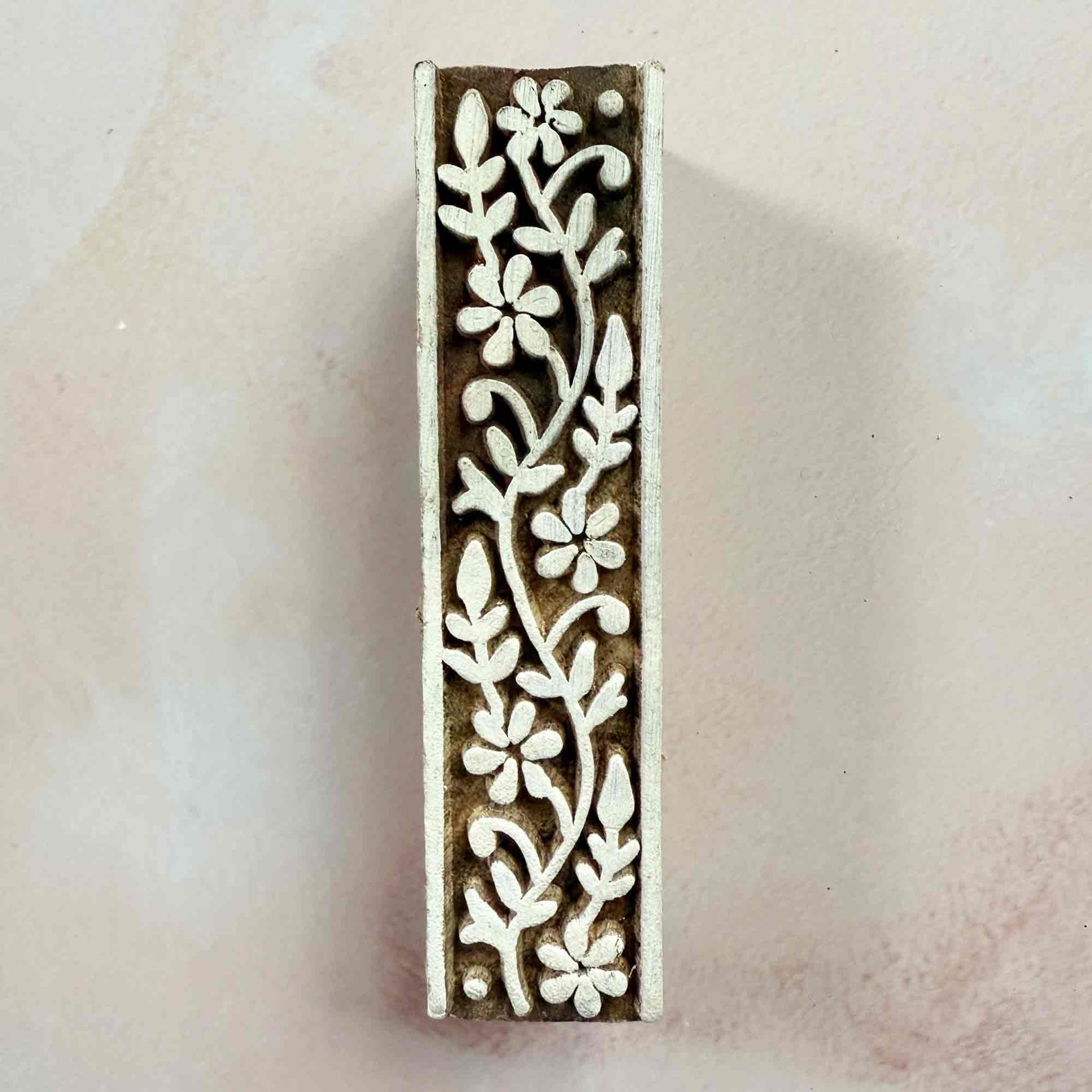 Decorative wooden stamp with floral pattern