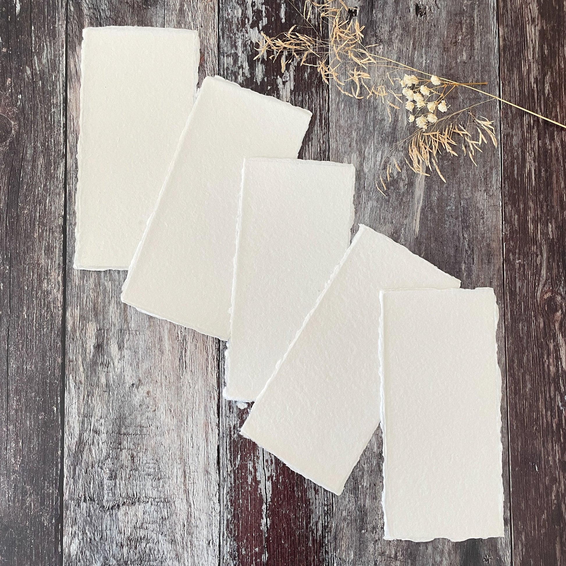 Premium white handmade recycled paper with a deckled edge.  DL size sheers of handmade cotton rag paper and card made in the traditional way.  Vegan Paper.  Watercolour paper.  By The Natural Paper Company