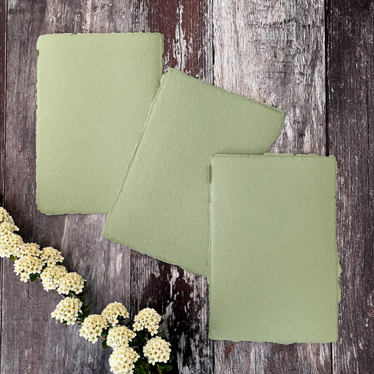 A5 handmade paper made from recycled cotton rag.  Desert sage colour paper with deckled edge.  Khaki green recycled hand made paper