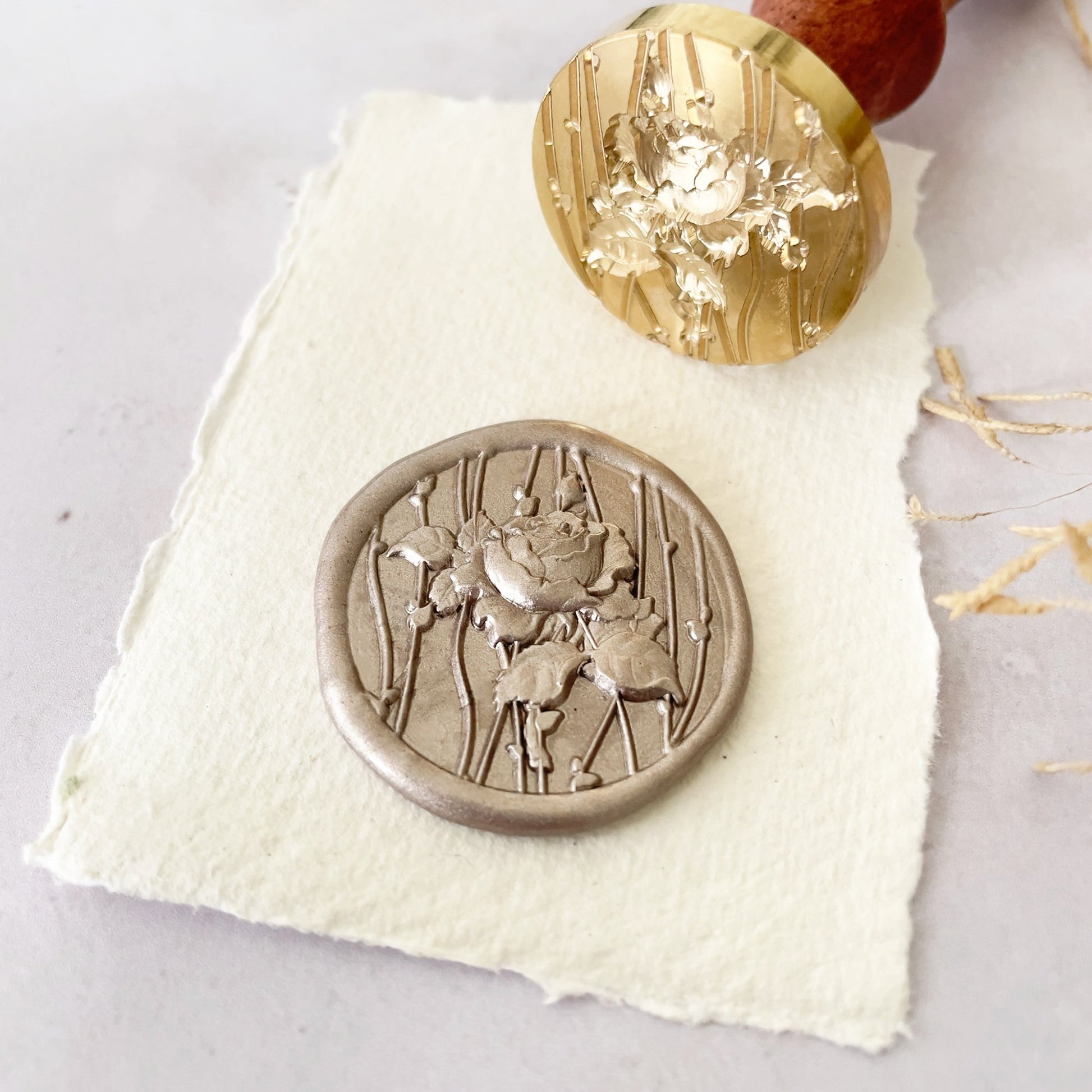 Floral wax stamp with rose and vine design.  Pretty sealing wax seal for decorating invitations, packaging, envelopes and more.  By The Natural Paper Company