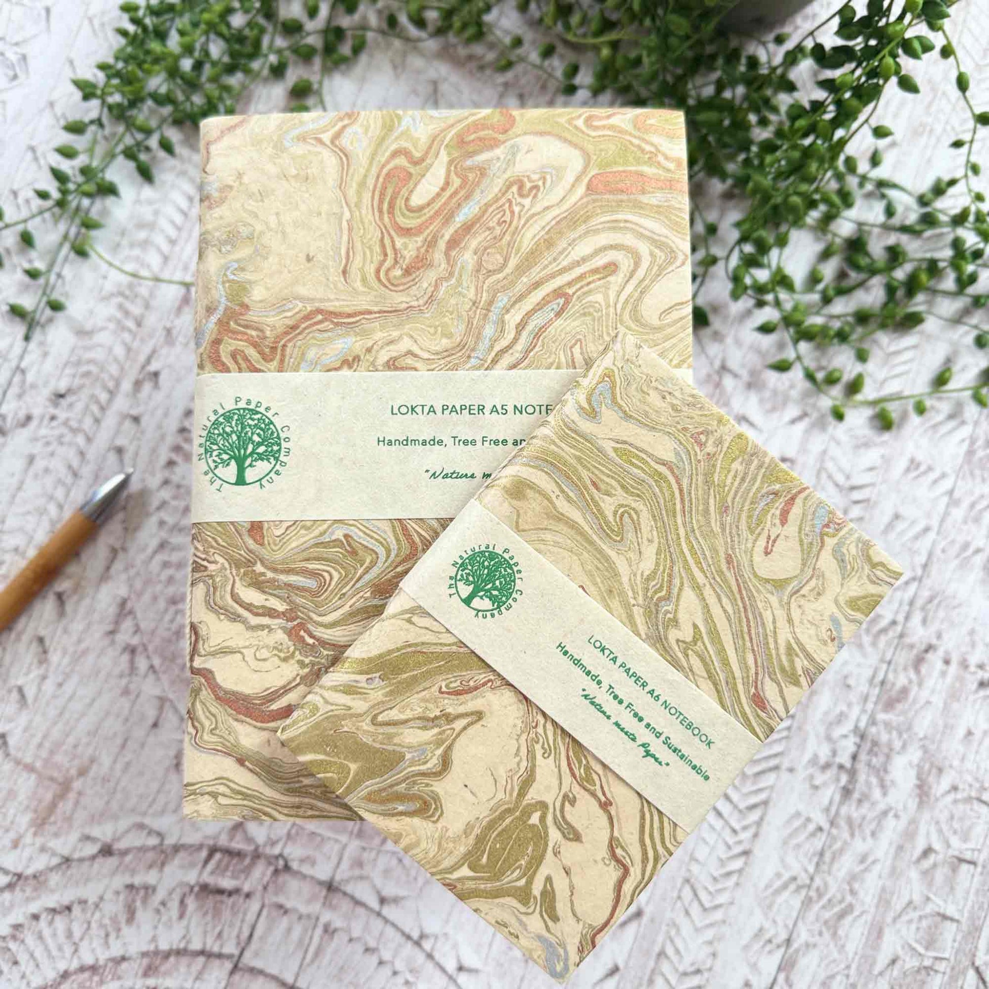 Midas Marble Lokta notebooks A5 and A6, branded wrap, hand‑marbled gold and copper

