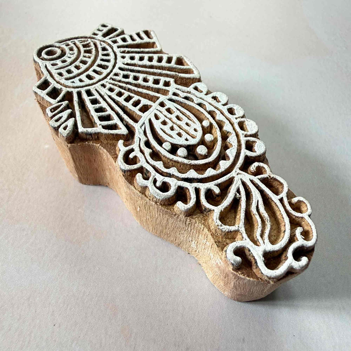 Wooden printing block with intricate design 