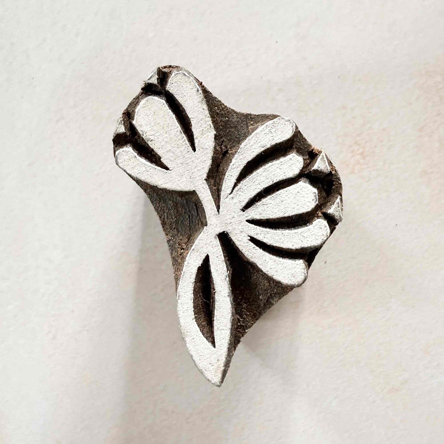 Nalini lotus-style Wooden Stamp measuring approximately 5 cm × 3.5 cm for traditional Indian block printing.