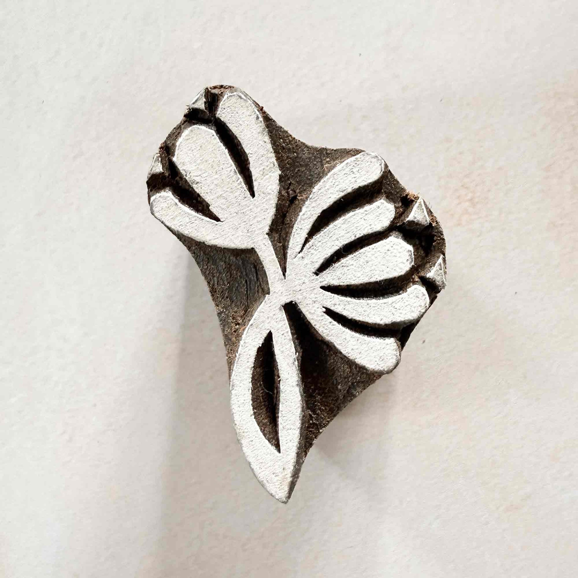 Nalini lotus-style Wooden Stamp measuring approximately 5 cm × 3.5 cm for traditional Indian block printing.