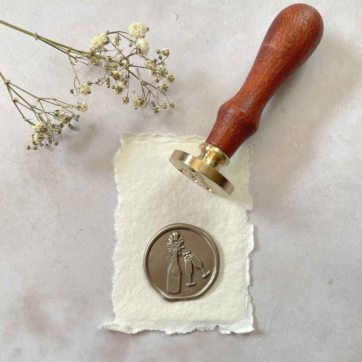 Champagne Wax Seal Stamp.  A traditional style wax stamp for decorating invitations, cards and gift wrapping.  Featuring an opened champagne bottle with glasses.