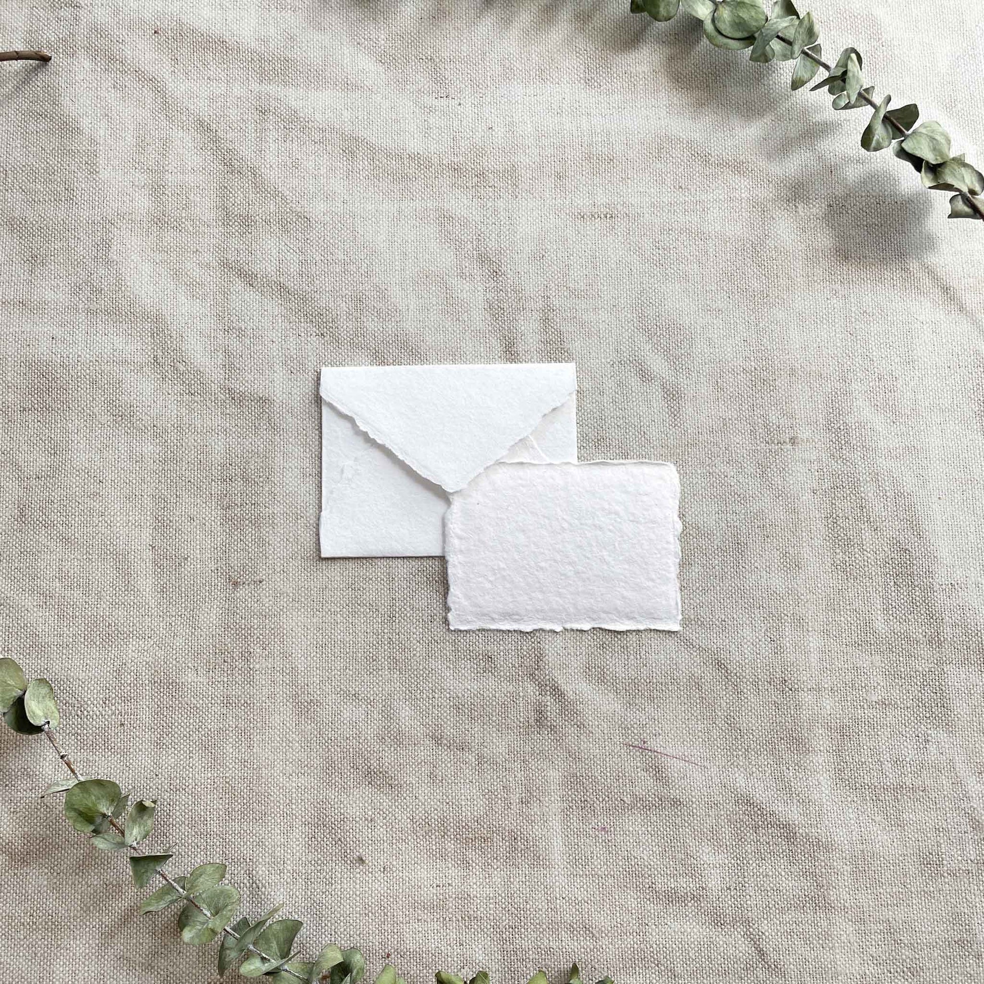 Small White Recycled cotton rag paper and envelopes with deckled edges.  