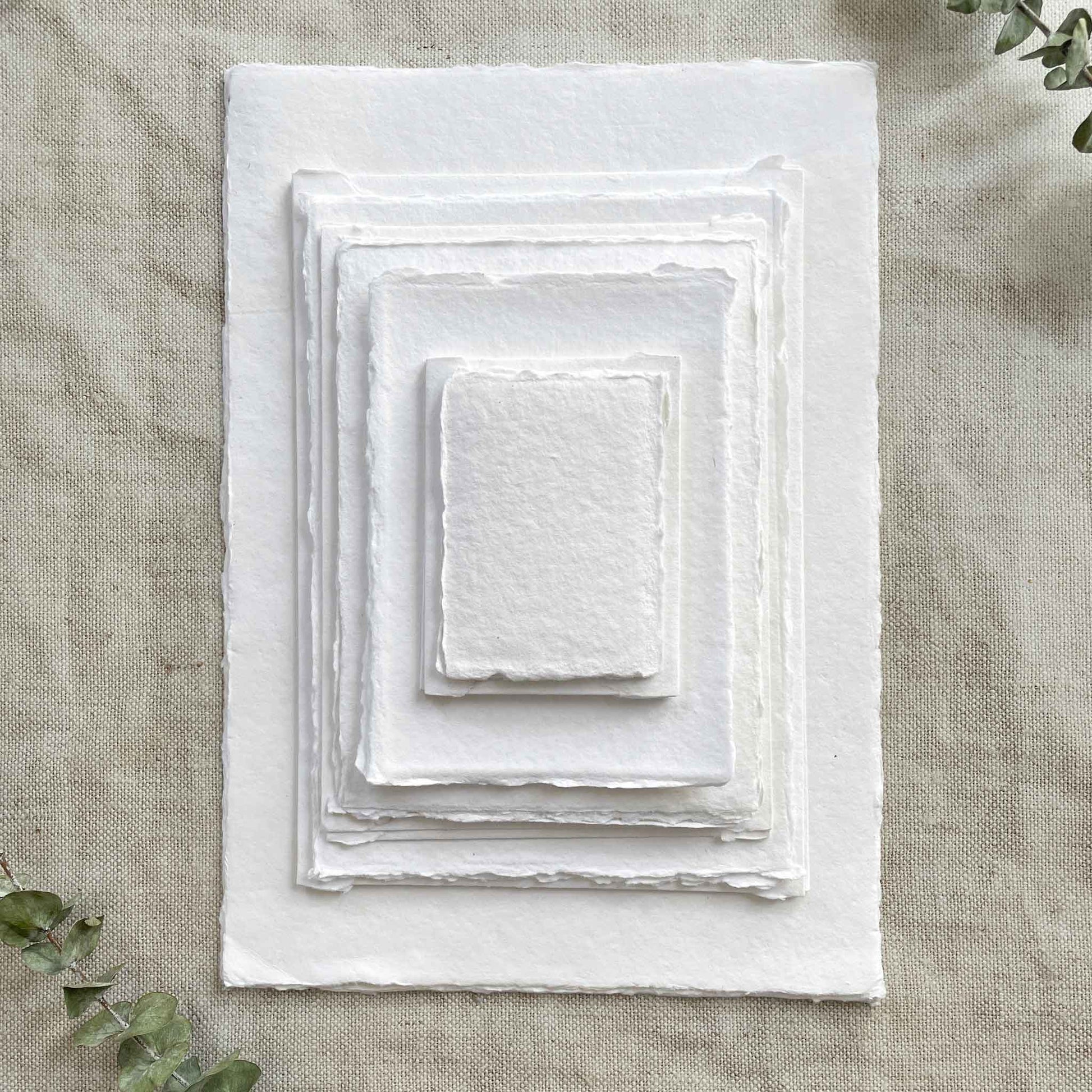 White handmade cotton rag paper and card with deckled edges in various sizes