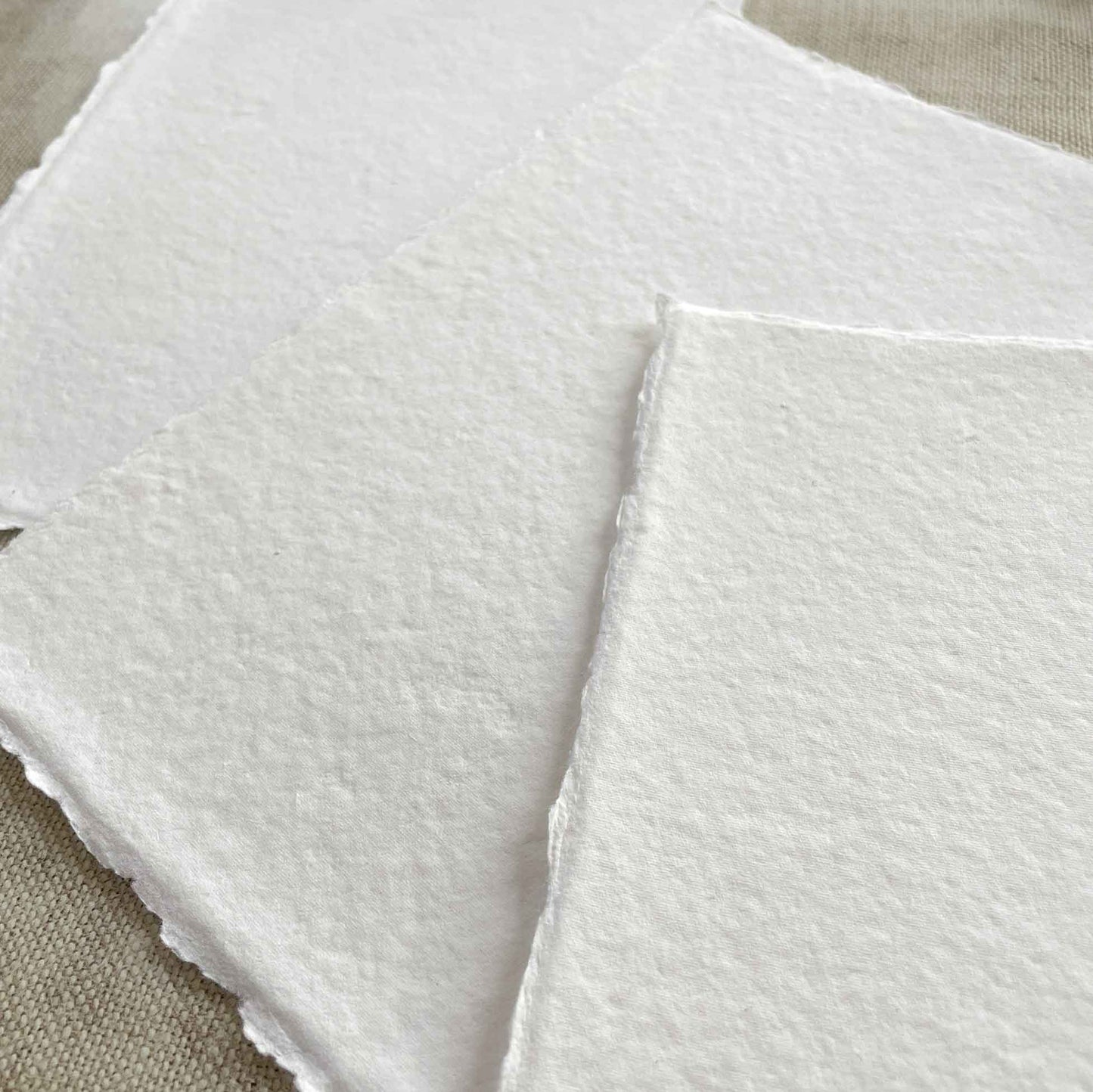 handmade cotton rag paper and car with deckled edges.  Bright White Colour