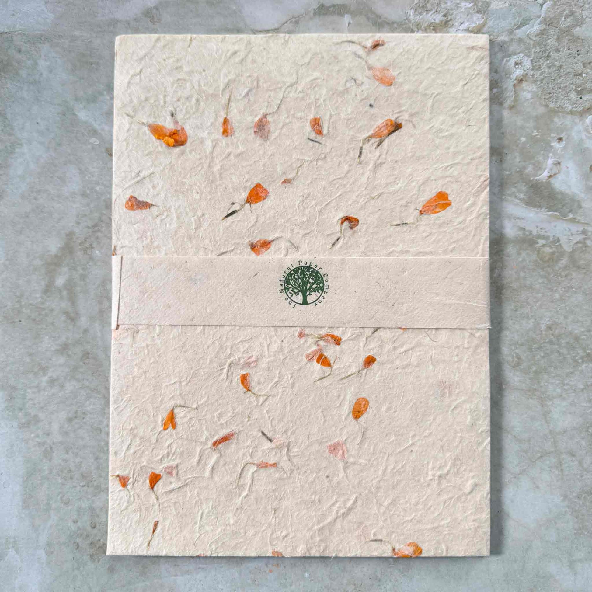 pack of A4 handmade lokta paper with marigold flowers