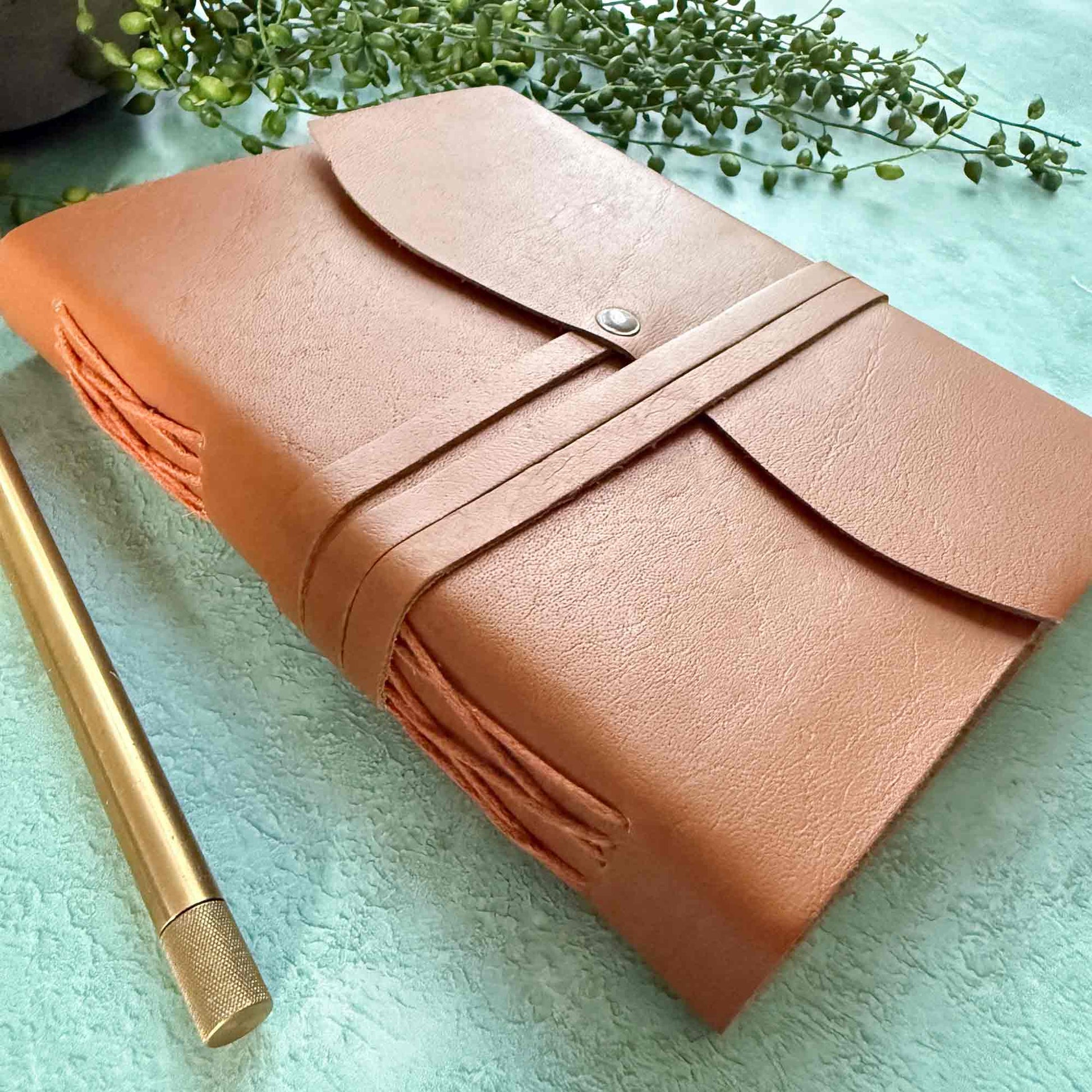 handmade tan leather notebook with cotton paper pages