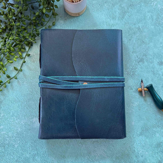 Handmade leather notebook in navy with leather wrap and cotton paper pages