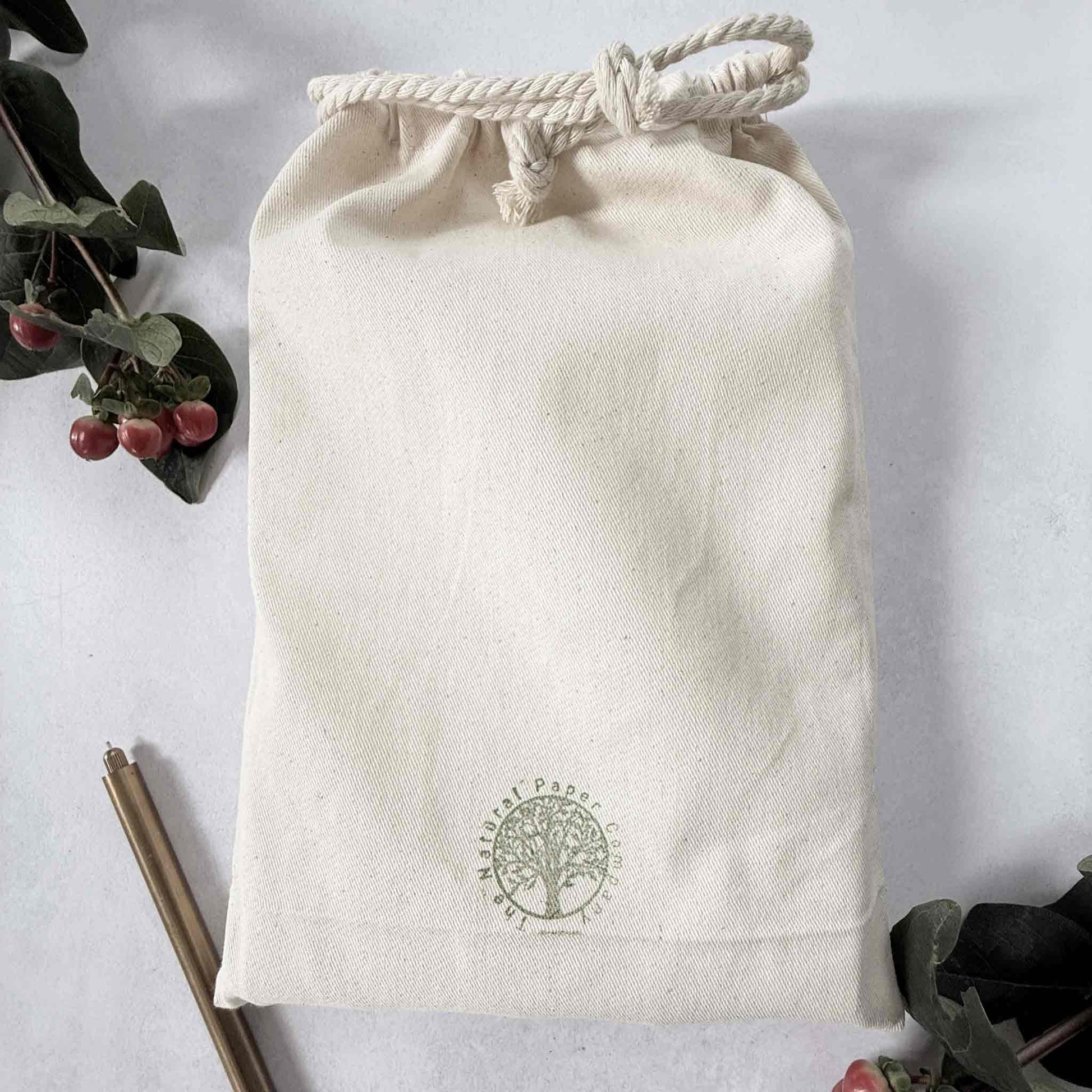 handmade leather notebook in a gift bag