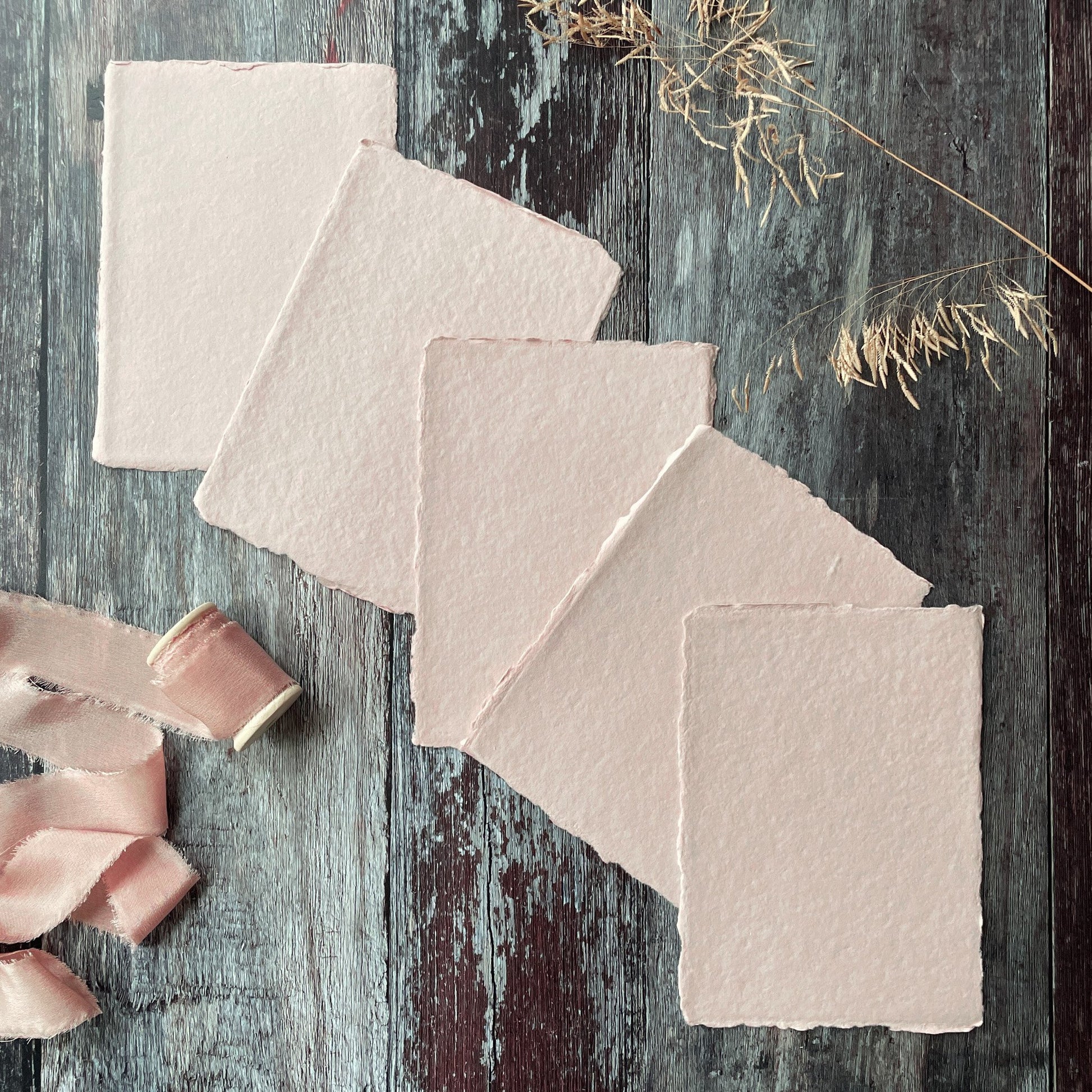 A6 sheets of handmade recycled paper with deckled edges.  Recycled cotton rag paper in blush pink.  By The Natural Paper Company