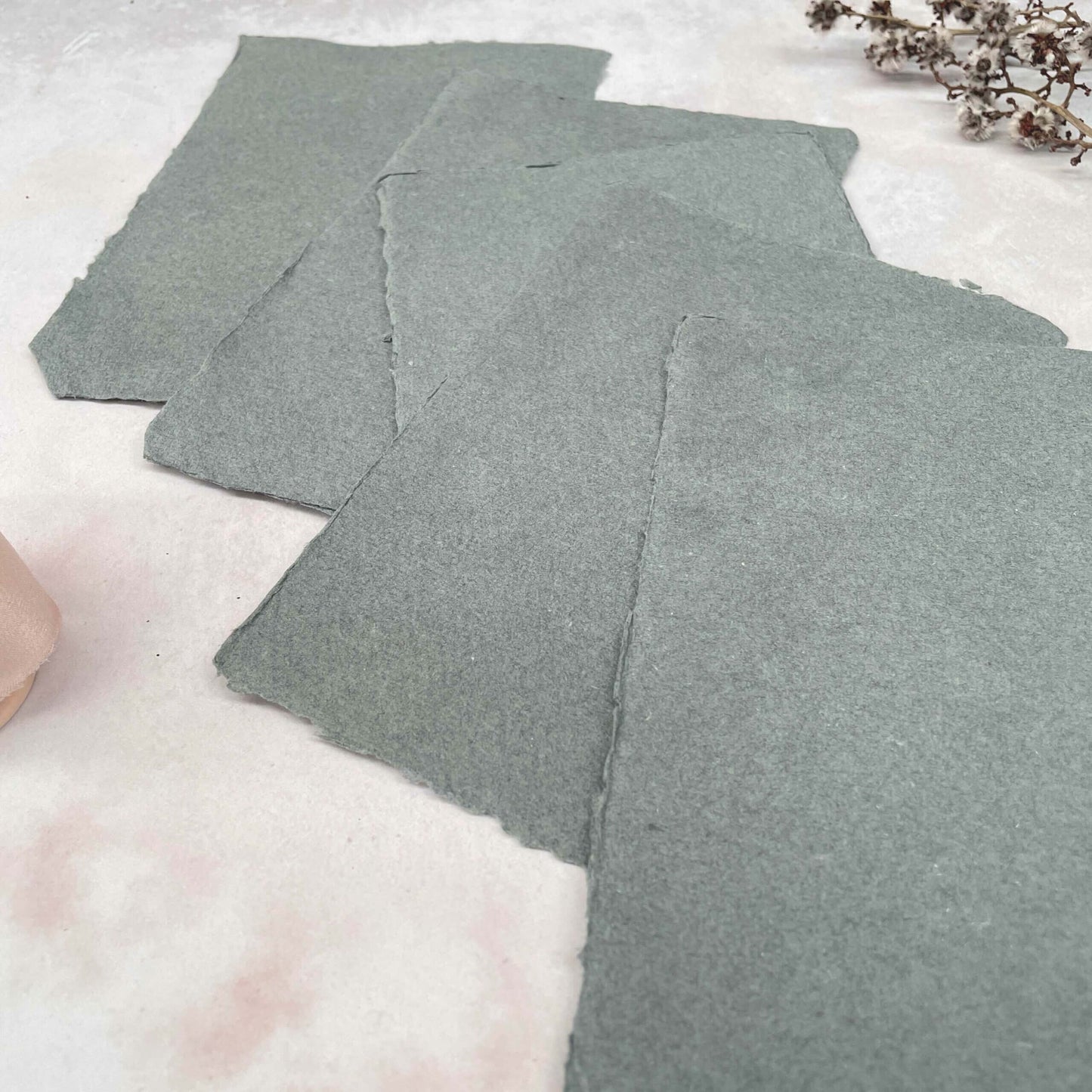 dark grey handmade paper with deckled edge