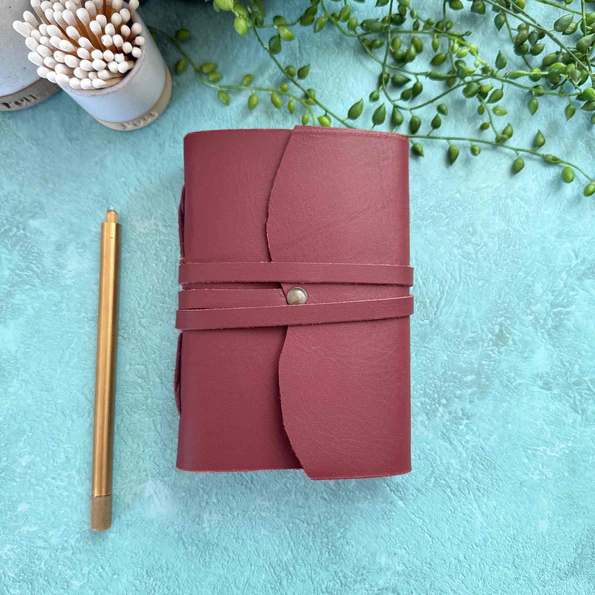 oxblood burgundy leather notebook with blank paper pages