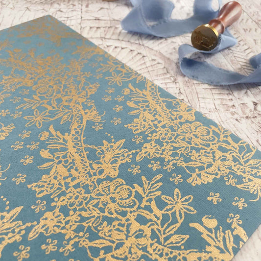 decorative a4 recycled paper in airforce blue and gold.  