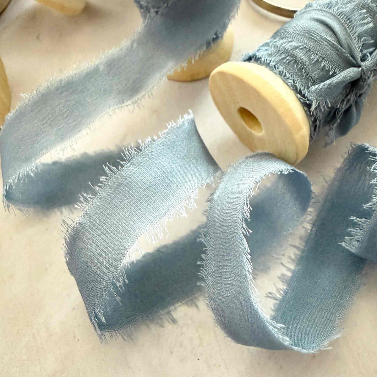 Airforce Blue raw edge silk ribbon showing soft Habotai silk texture
