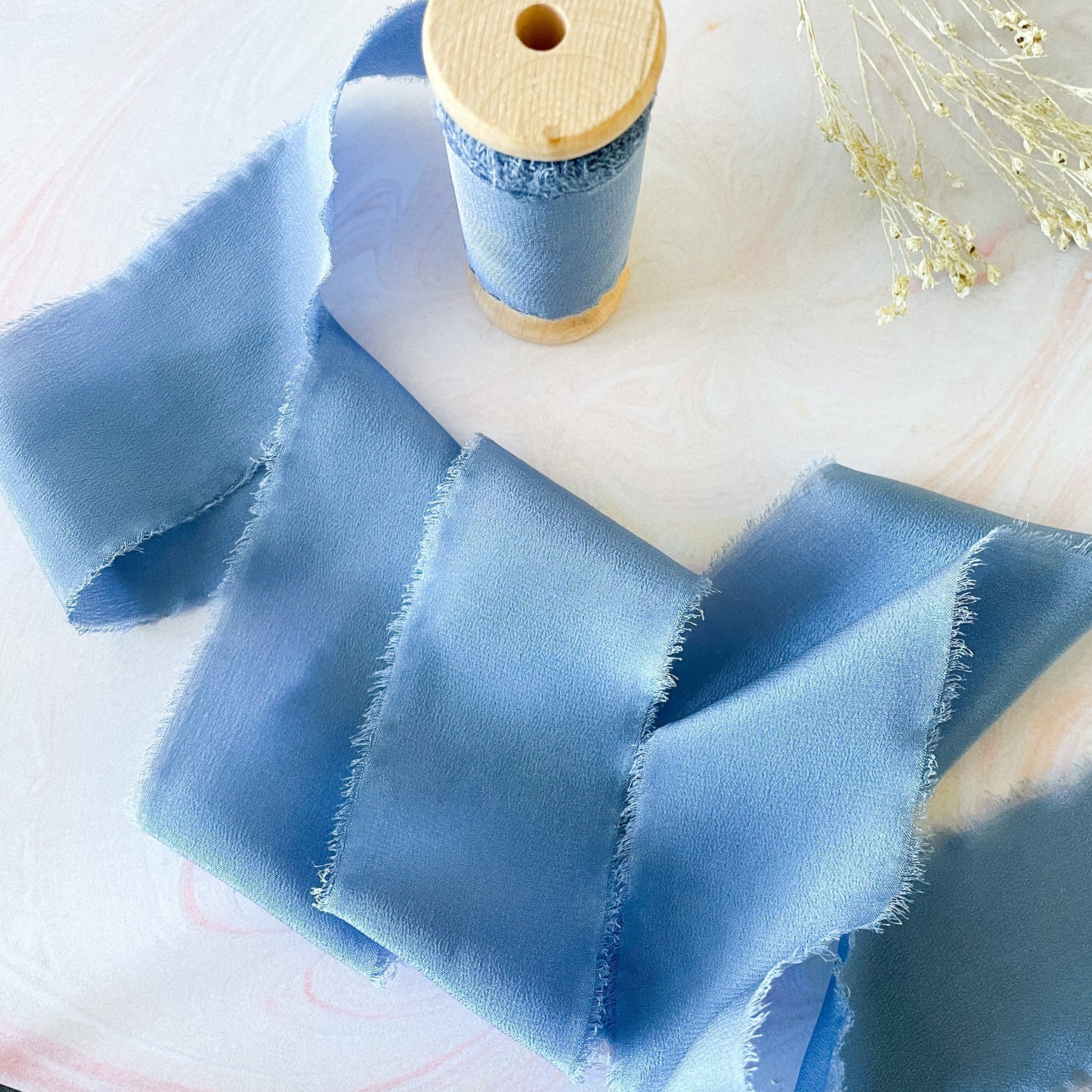 Airforce Blue silk ribbon for crafts.  Luxury silk ribbon on a wooden reel.  By The Natural Paper Company.