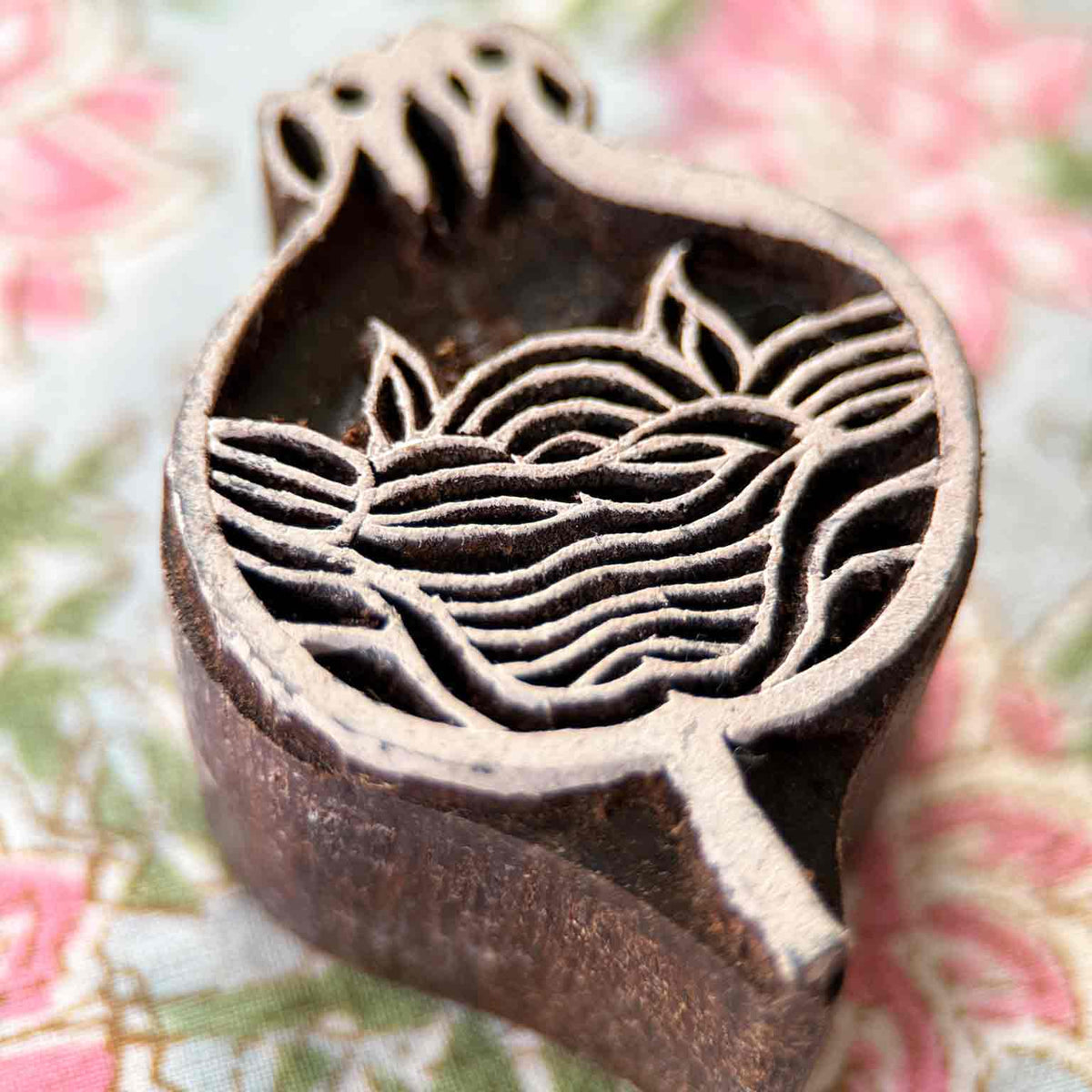 Close-up Anar Wooden Stamp showing a hand-carved pomegranate design for traditional fabric and paper block printing.