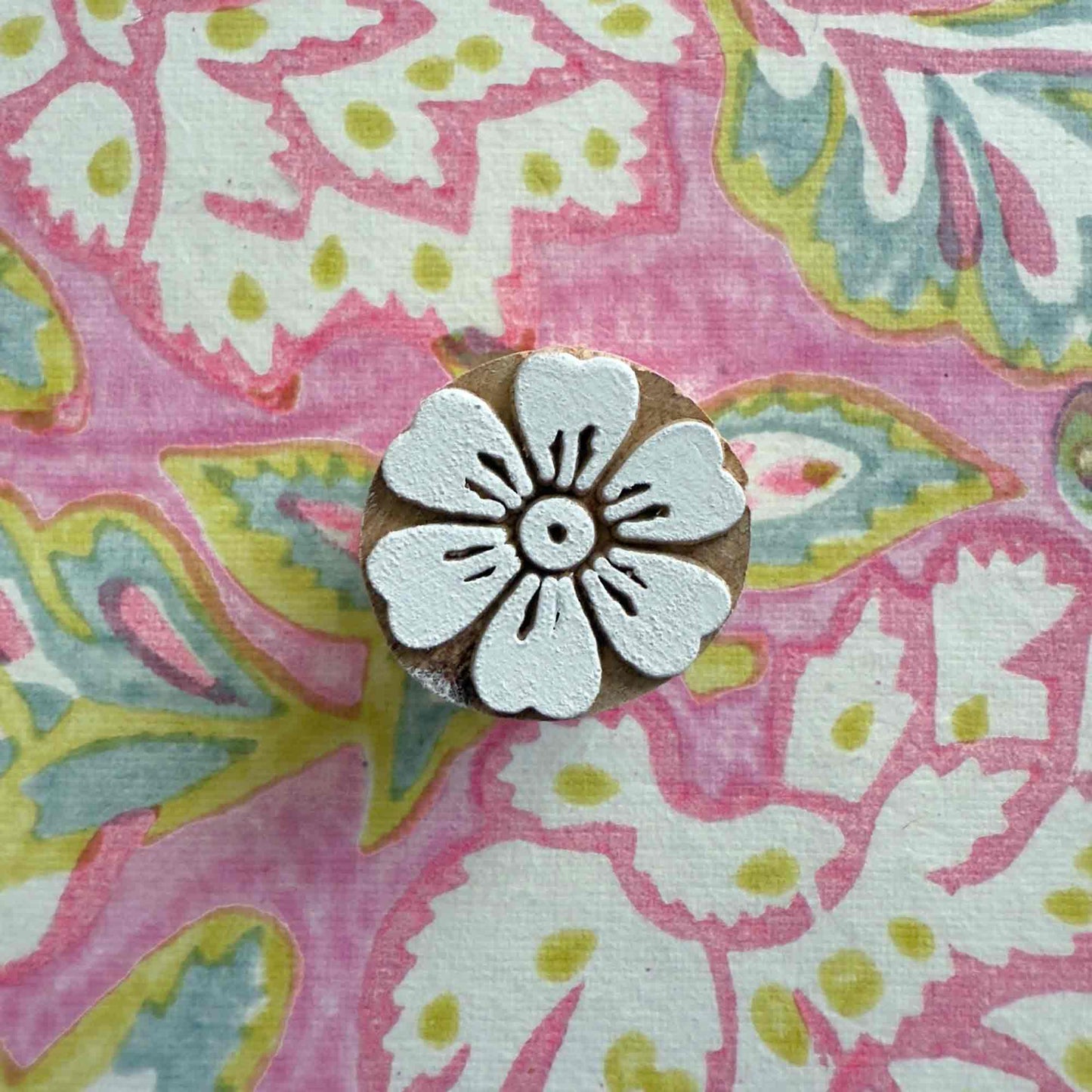small Indian wood block stamp with a flower design