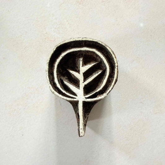 Ankur botanical Wooden Stamp with a stylised leafy sprig inside a rounded hand-carved frame.