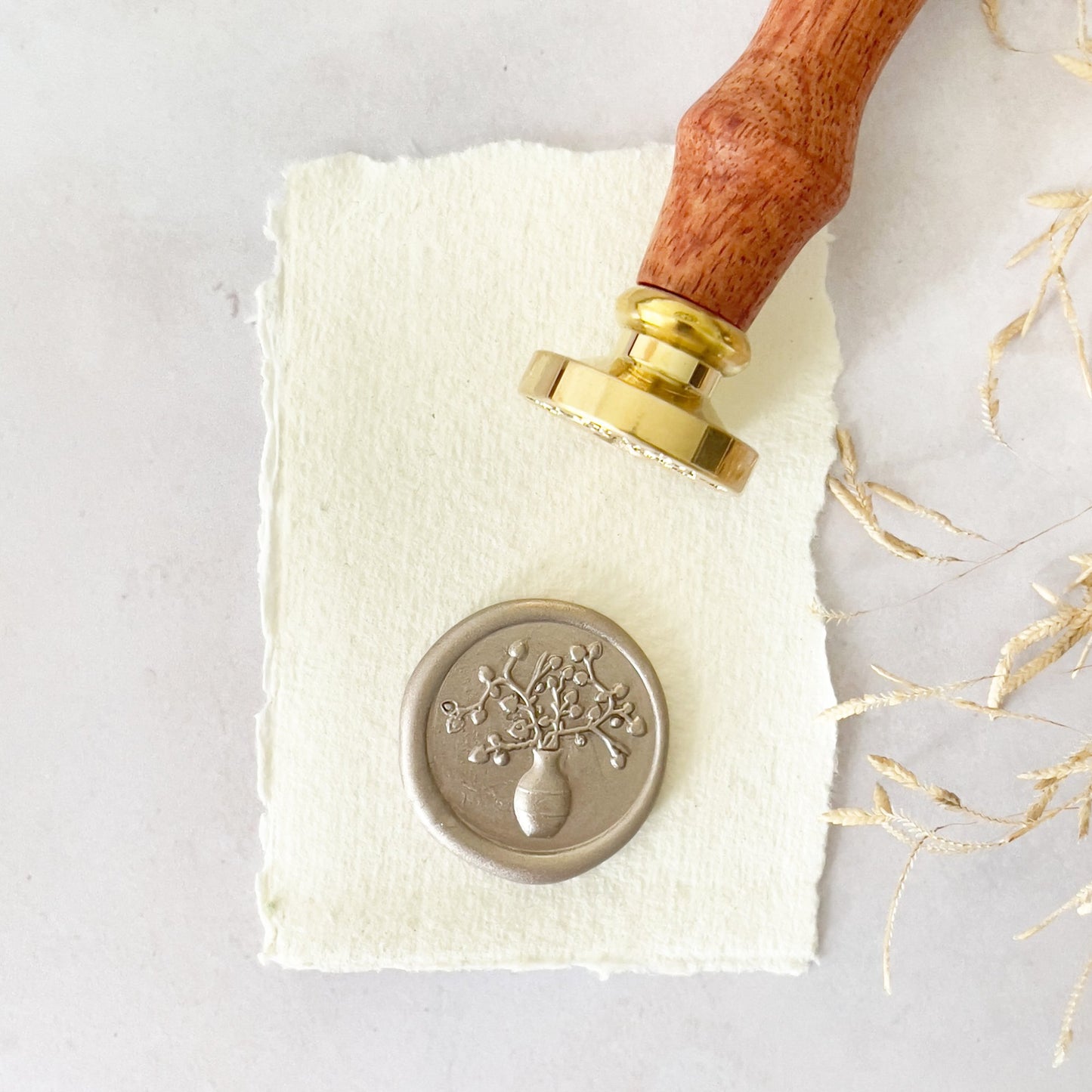 Floral wax seal stamp design By The Natural Paper Company.  Pretty vase design with delicate flowers.  