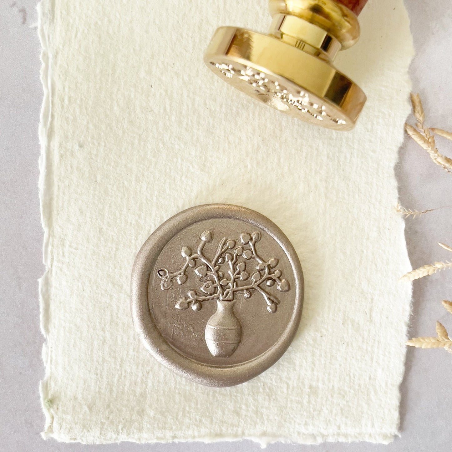 Pretty wax seal stamp with a vase and flower design.  Greek vase theme wax stamp for making wax seals.  Brass stamp with a wooden handle.  By The Natural Paper Company