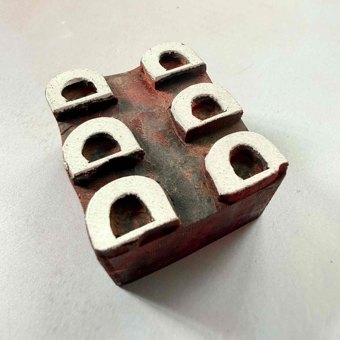 Arcades wooden stamp — traditional hand-carved arch design viewed from side