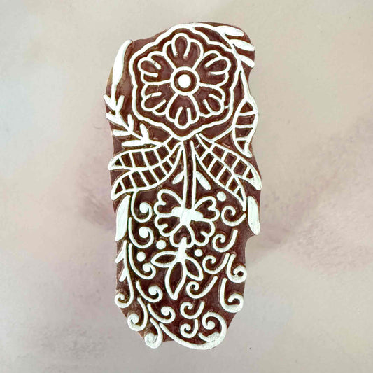 Decorative stamp with floral design 