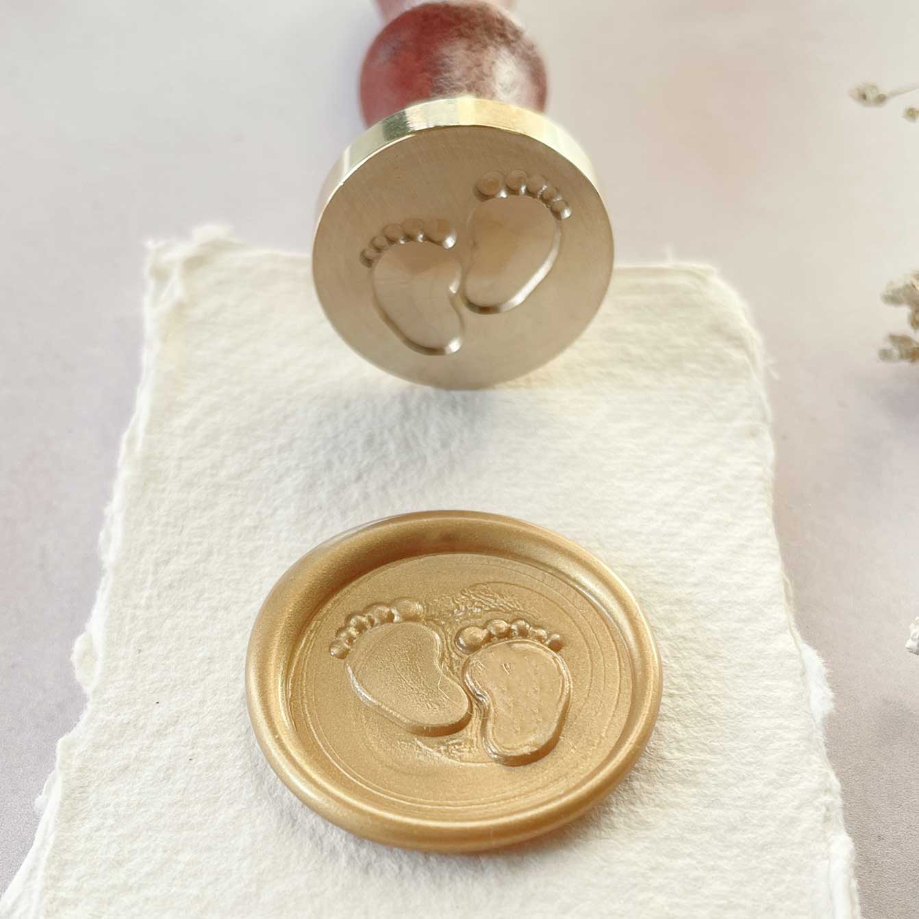 Baby footprint wax seal stamp.  Sealing wax stamp with feet design.  Perfect to make wax seals for decorating baby shower invitations, birth announcements and packaging.  by The Natural Paper Company