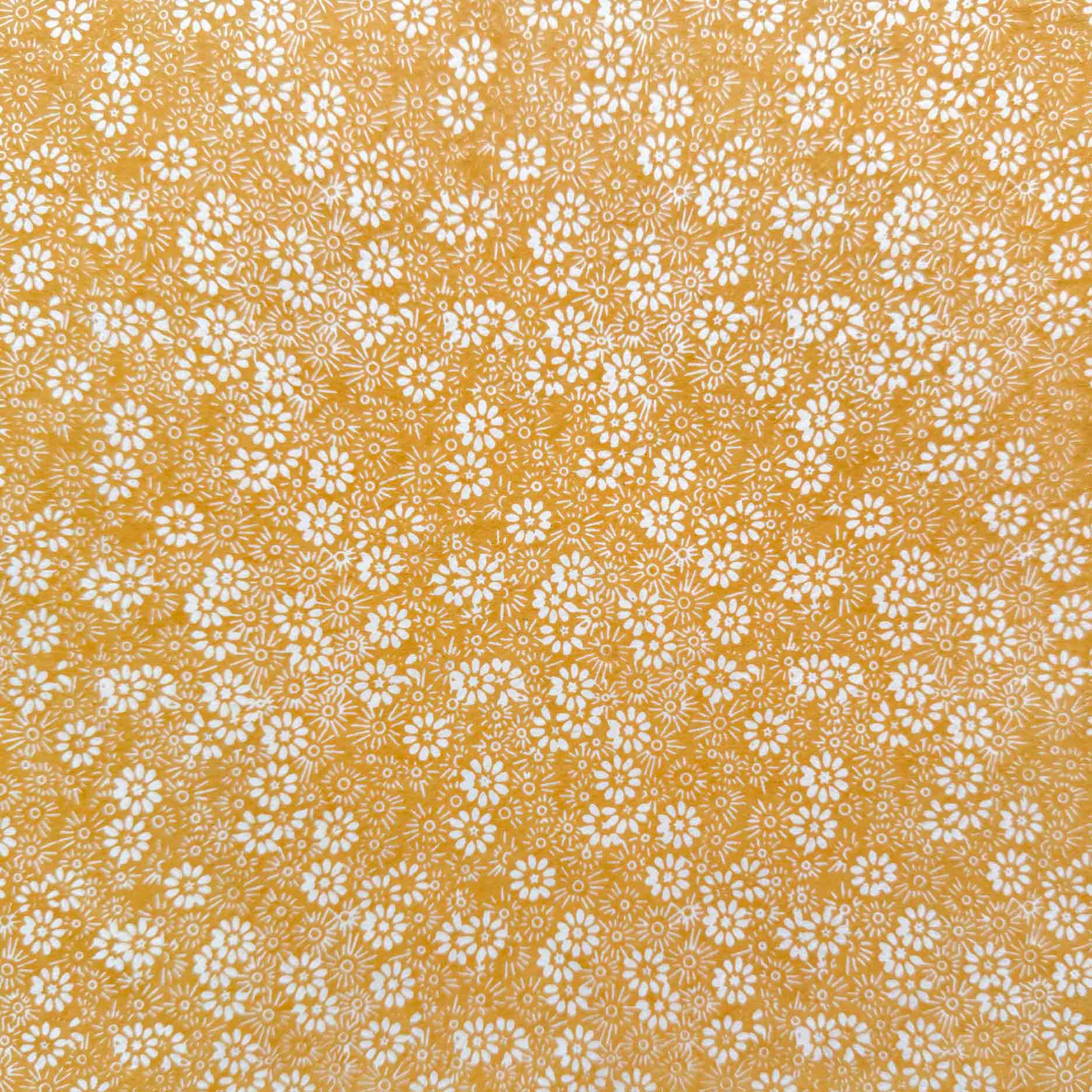 lokta paper gift wrap with a daisy pattern in mustard and ivory