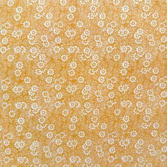 lokta paper gift wrap with a daisy pattern in mustard and ivory