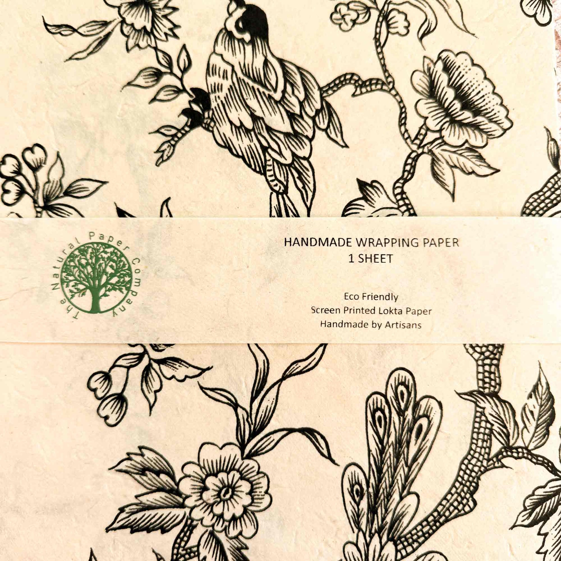 lokta paper gift wrap with a black and white flowery pattern with birds