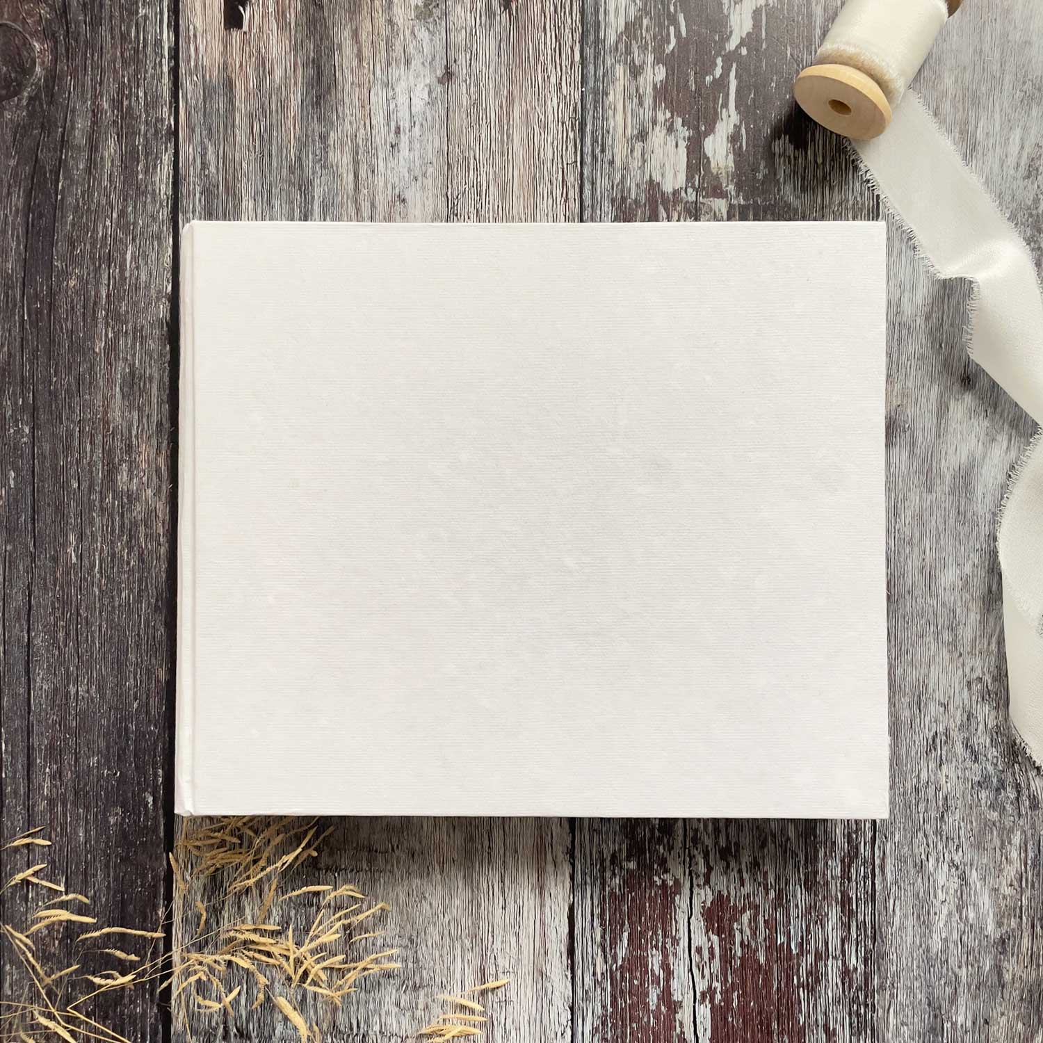 Blank journal made from white handmade paper.  These blank books have a hard cover that is perfect to decorate and personalise.  By The Natural Paper Company