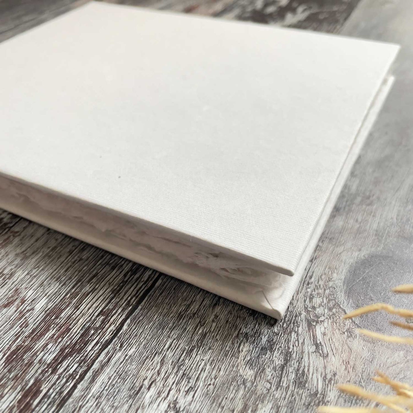 Blank book made from handmade cotton rag paper with deckled edges.  Blank white book for making guest books, journals and personalised note books.  By The Natural Paper Company